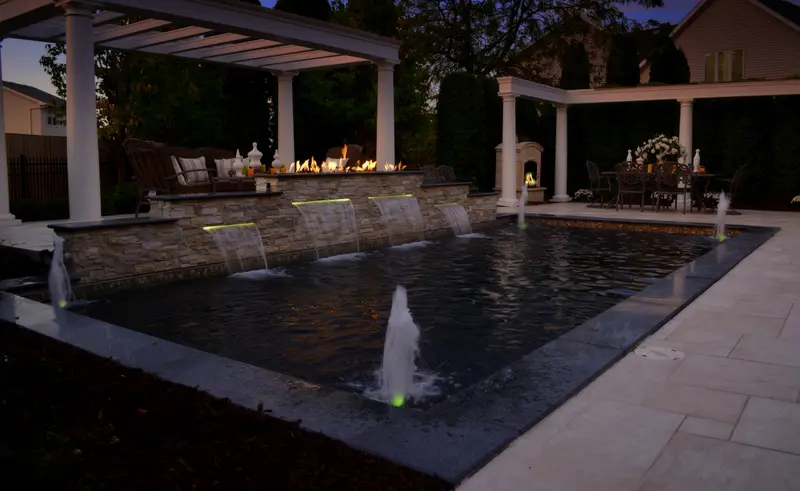 pool with fountain at night