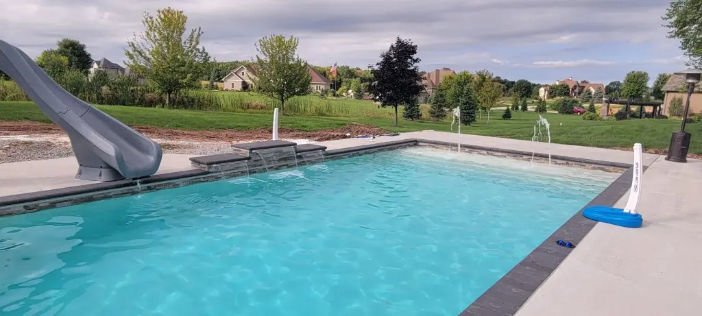 large rectangle pool with gray slide